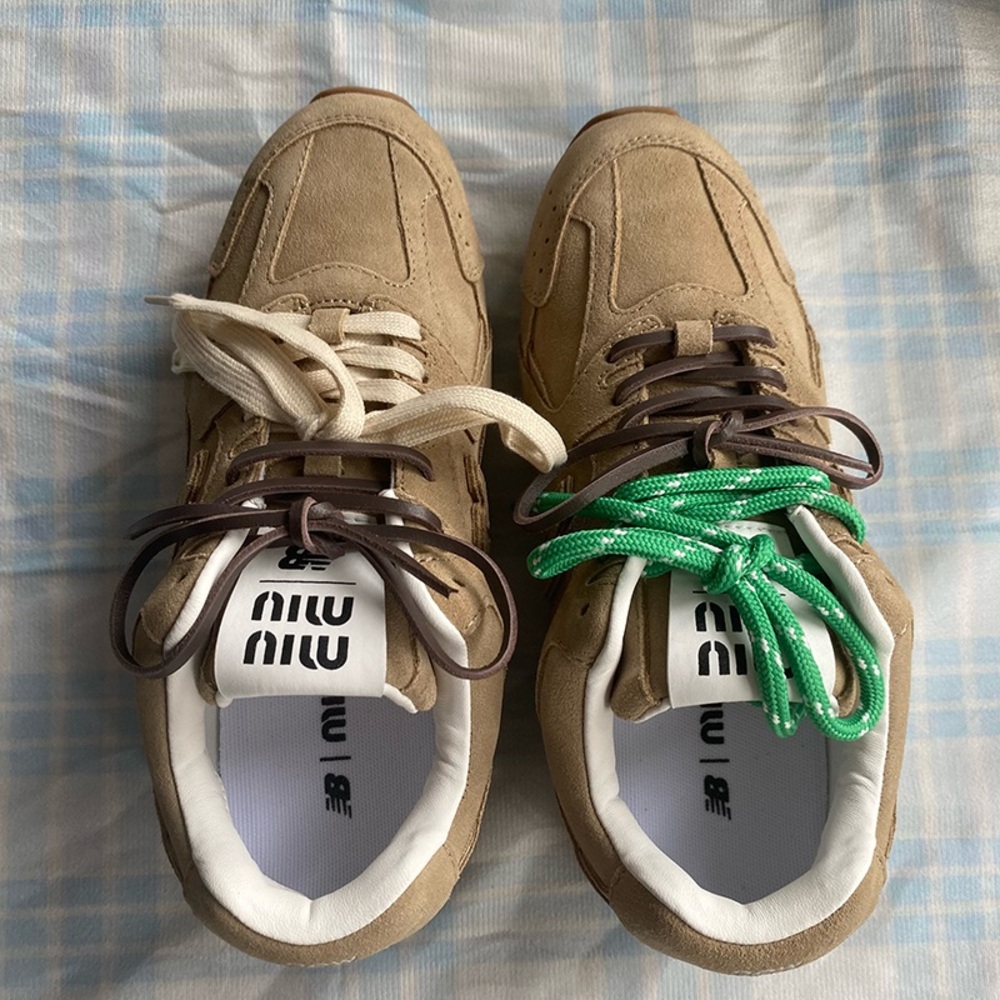 Miu Miu Sneakers With A Light Khaki Suede Upper And A Creative Lacing Design.